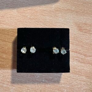 Elegant gold tone silver white and blue topaz stud earrings.